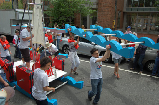 The “Sis-y-phus” team affiliated with the Harvard Physics Lab named their entry after the mythic Greek character who, as punishment from the gods, was forced to forever roll a boulder up a hill, only to have it roll back down again before it got to the top. The sculpture is a square-wheeled sailboat riding on three sets of wavy track that must be repeatedly moved back in front of the boat after it passes over them. “Our boat is kind of nonsensical and going nowhere—or not going somewhere fast. So we thought it would be a great fit,” artist Kim Bernard said. (Greg Cook)